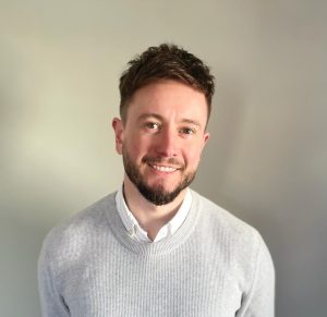 Portrait image of Jac Lloyd-Jones of Astra Group smiling.