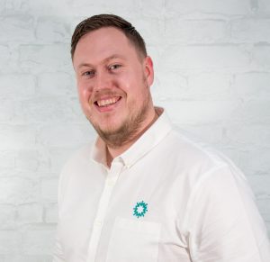Portrait image of Joseph Derbyshire of Astra Group smiling.